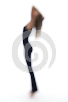 Blurry woman dancing on a white backdrop photo
