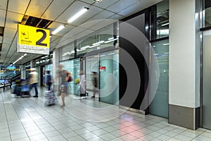 Blury passenger or tourist at the arrival terminal 2 photo