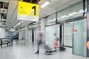 Blury passenger or tourist at the arrival terminal 1 photo