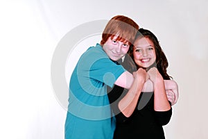 Blushing boy Teen Couple Hugging photo