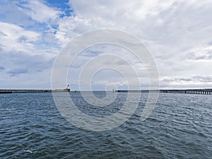 Blyth, Northumberland, UK. Lighthouse and pier at estuary mouth of Port of Blyth