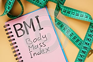 BMI body mass index sign and measuring tape