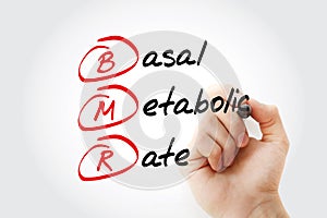 BMR - Basal Metabolic Rate acronym with marker, concept background