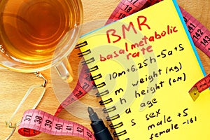 BMR basal metabolic rate formula in a notepad.