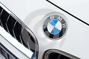 BMW Logo on white car, BMW is a german brand multinational company which currently produces automotive