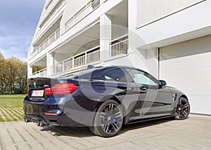 BMW M4 parked in front of apartment building, Turnhout, Belgium