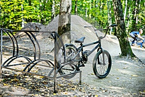 BMX bike parked in forest park