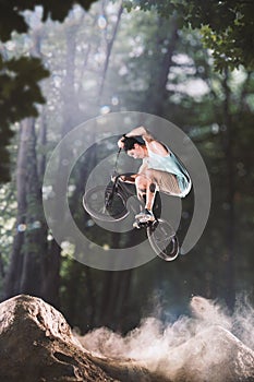 Bmx bike rider in the forest