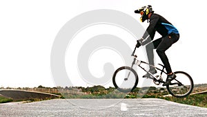 Bmx biker performs a stunt on his bicycle