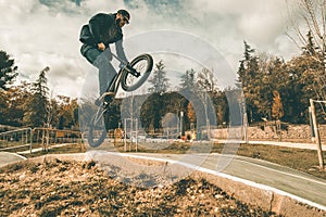 BMX rider making tricks .Guy riding a bmx bike