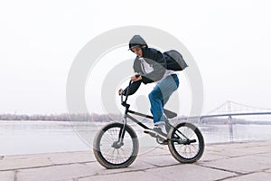 BMX rider rides a bike in the open air. BMX concept. Street style