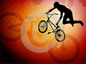 Bmx stunt cyclist silhouette on the abstract backg