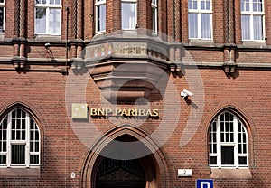 BNP Paribas international bank branch in an very old building with arch entrance