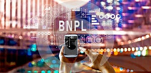 BNPL - Buy Now Pay Later theme with big city at night