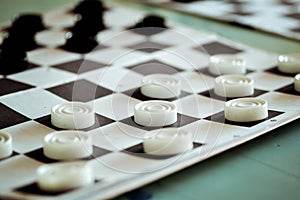 Board with checkers closeup