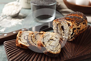 Board with freshly baked poppy seed roll