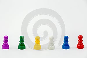 Board game with different colored game pawns on it. Ludo or Sorry board game play figures