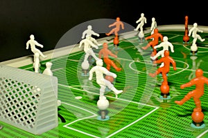 Board game european football with green field, red and white soccer players