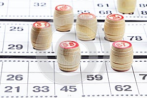 Board game lotto with wooden barrels. Lotto cards. Bingo games. Gambling