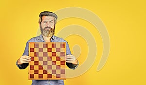 Board game. Thoughtful bearded man play chess. Chess figure. Intellectual game. Enjoy tournament. Grandmaster player