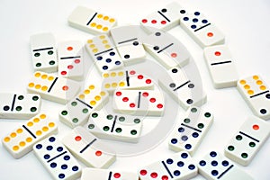 Colored dominoes lined up, domino effect photo
