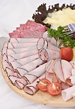 Board of ham and meat slices