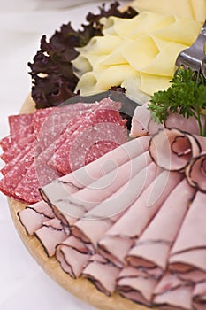 Board of ham and meat slices
