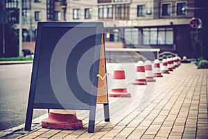 board for inscription on the sidewalk near the coffee shop