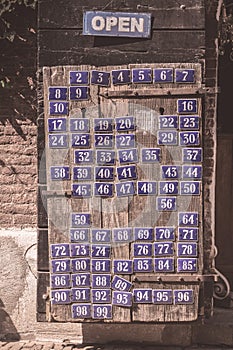Board with metal enameled plates of numbers