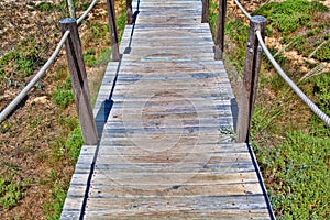 Board path way to the sandy beach