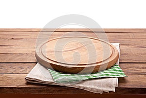 Board for pizza and tablecloth on wooden table isolated. Canvas, dish towels on white background top view mock up