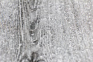 Board of wood. Old and cracked. The surface is rough and uneven.