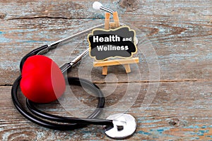 A board with the word health and Wellness and stethoscope. The c