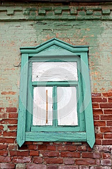 The boarded-up window