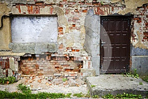 Boarded up window and old door