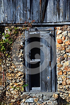 Boarded up Window on Stone House