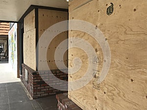 Boarded up windows at a business
