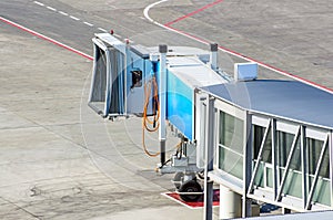 Boarding bridges at the airport and a view of the steering track and asphalt