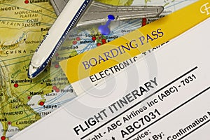 Boarding pass and flight itinerary photo