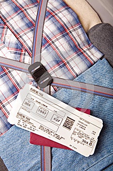 Boarding pass passport on suitcase