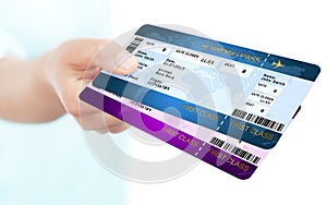 Boarding pass tickets holded by hand over white background