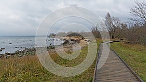 Boardwalk  along the rocky beach of Tallin Bay sea on Paljasaare peninsula