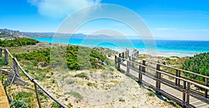 Boardwalk in Capo Testa under a cloudy sky