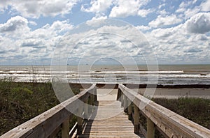 The boardwalk leading to the beach on a cloudy day