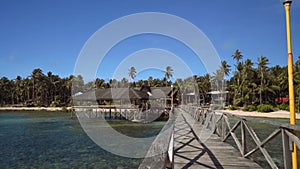 Boardwalk in ocean in front of tropical island - Siargao Island, Philippines