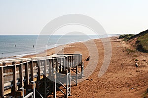 Boardwalk on the red sands- beach,Canada