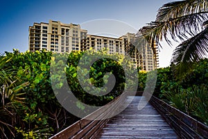Boardwalk trail and hotel on Singer Island, Florida.