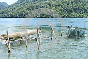 Boat above sea and fishnet in Warsambin