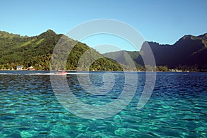 Boat across a blue lagoon