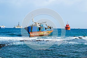 Boat aground on the coast